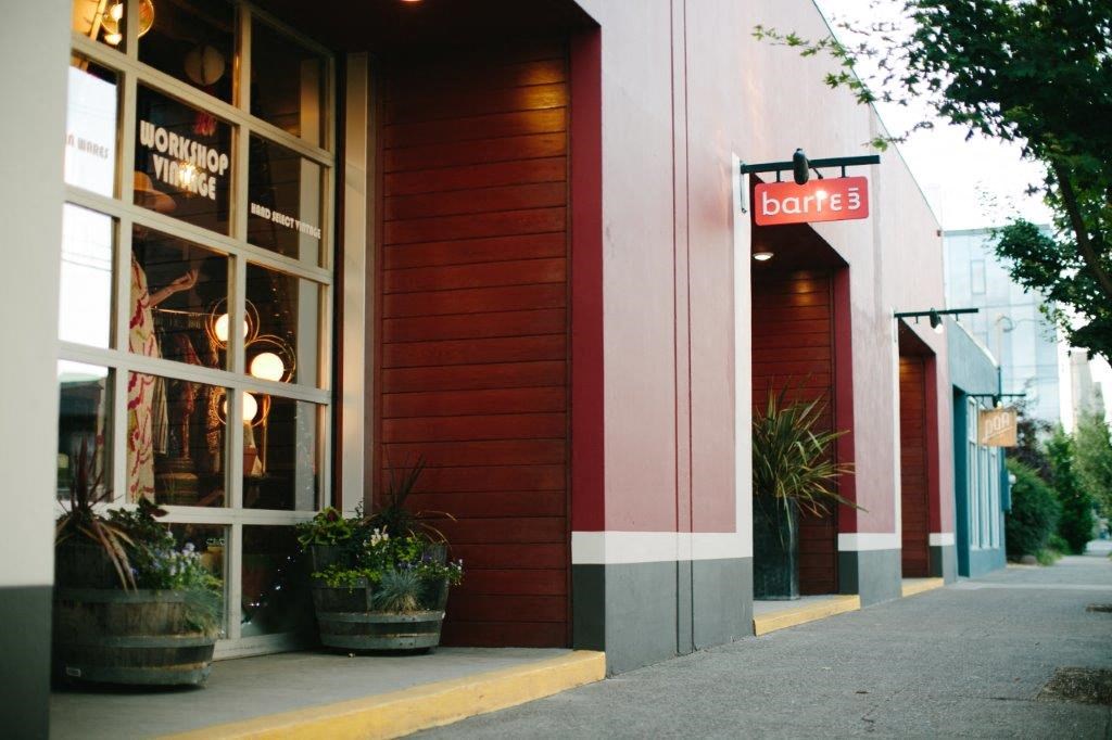 a store front with a sign in the window