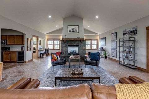 A living room with a fireplace and a couch.