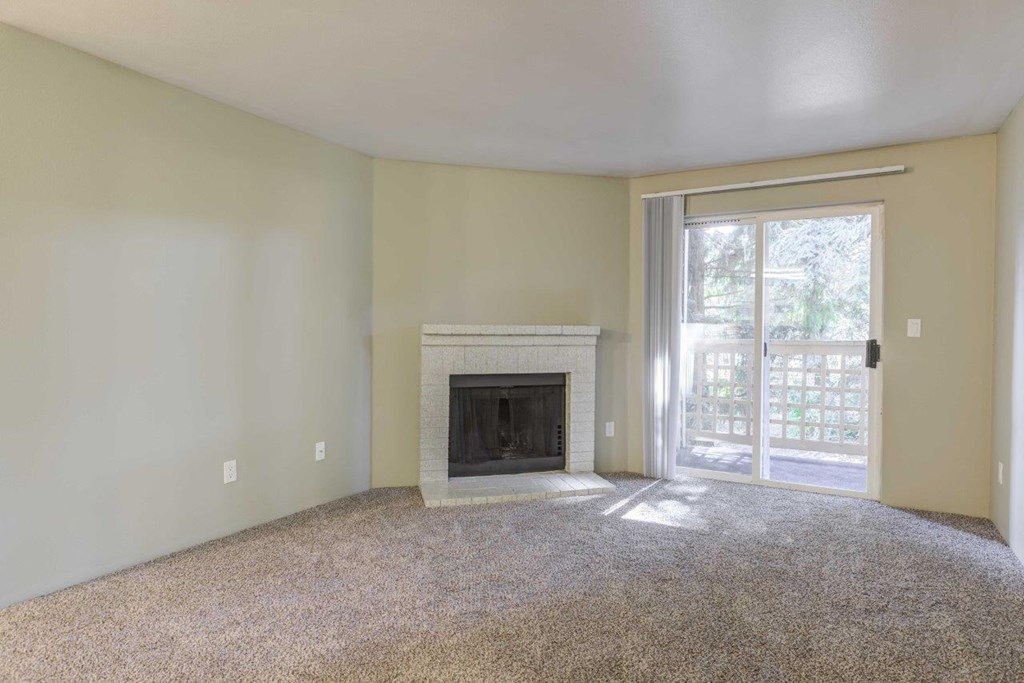 Cascadia Pointe Apartments in Everett, Washington Living Room with Fireplace and Private Patio