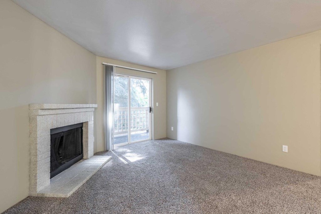 Cascadia Pointe Apartments in Everett, Washington Living Room with Fireplace and Private Patio