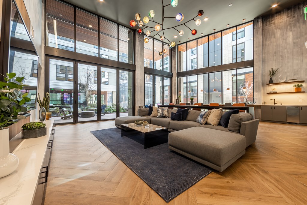 A modern living room with a large couch and a coffee table.