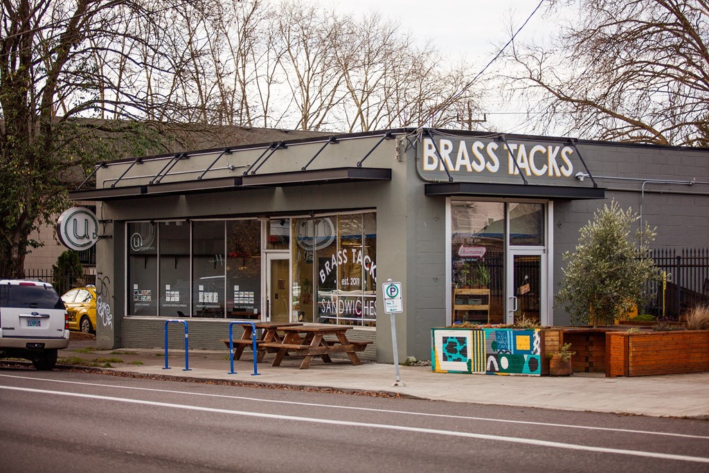 the exterior of a bass acids store on the side of a street