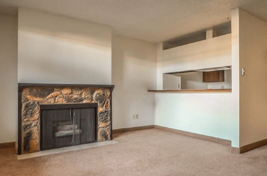 Clearwater Square Apartments Living Room Fireplace and Kitchen