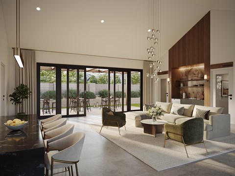 A modern living room with a bar area and a view of the backyard.