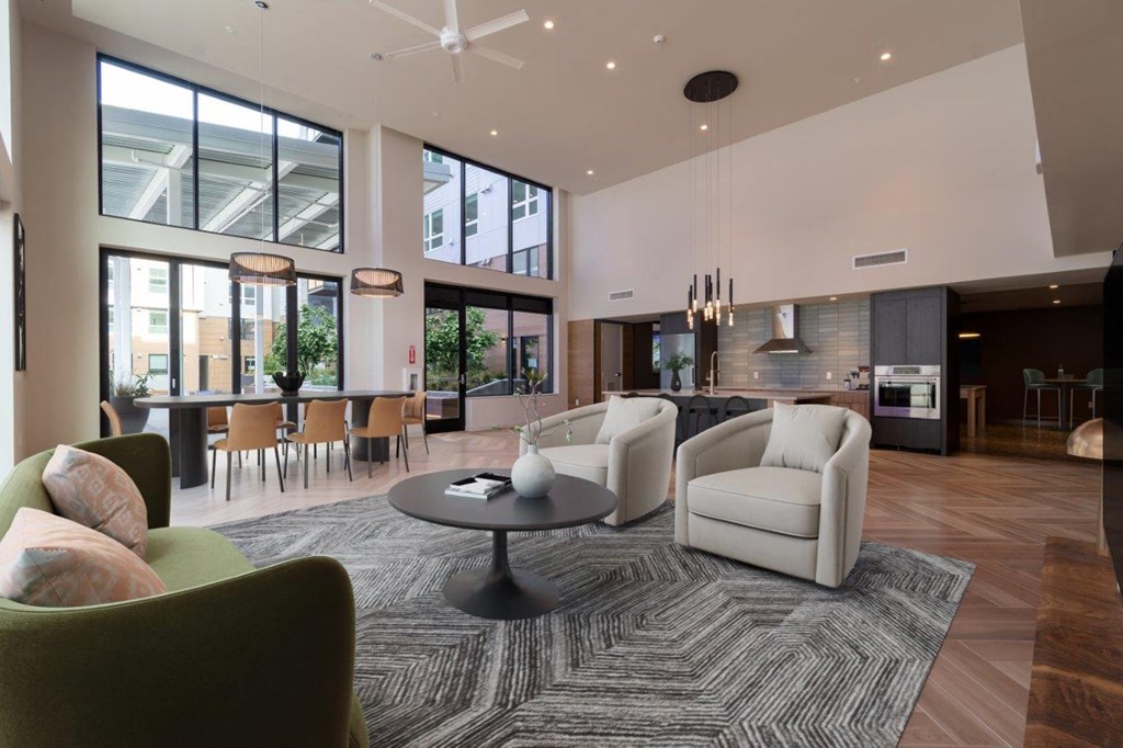A modern living room with a green armchair and a coffee table.