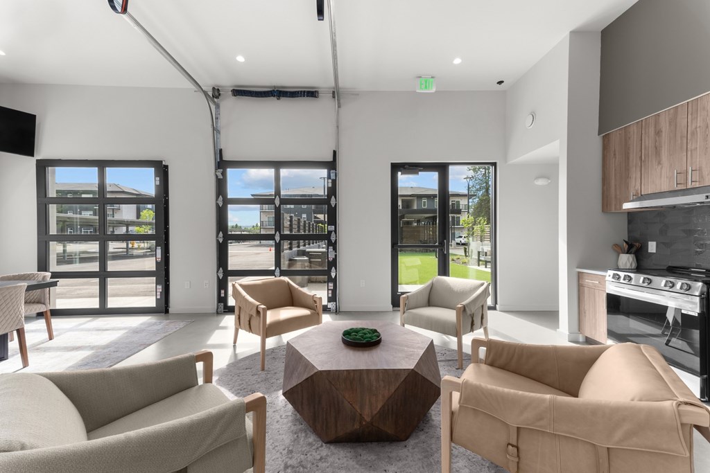 A modern living room with a large coffee table and comfortable seating.