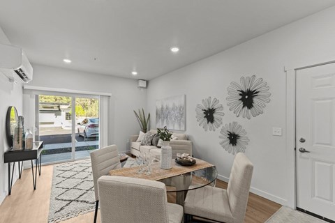 Open concept dining and living area with modern decor at Confluence on Farwell Apartments, Washington