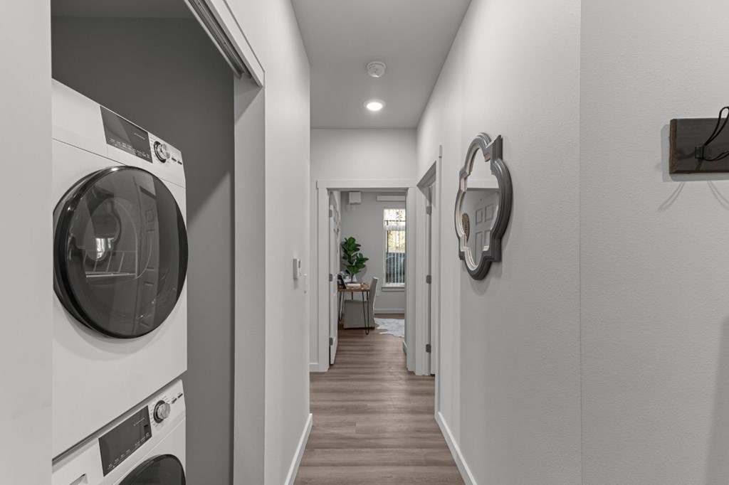 A modern laundry room with a washer and dryer.