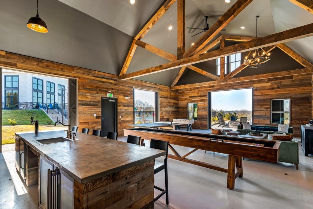 A kitchen with wooden cabinets and a large island.