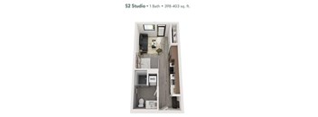A small studio apartment with a bathroom and a bed.