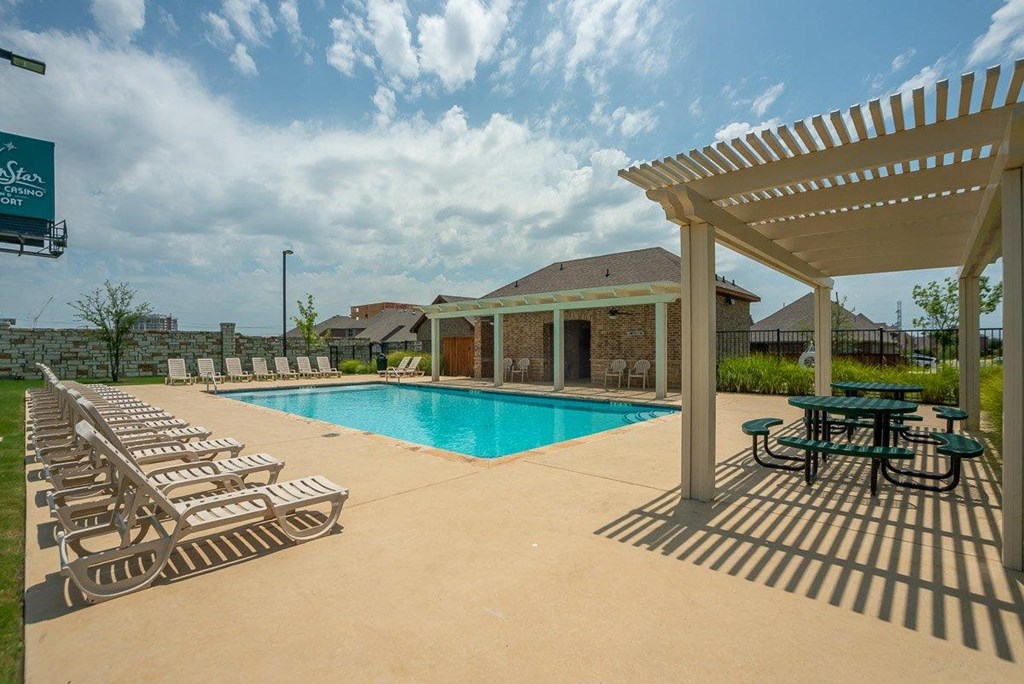 Cottages at the Realm Pool with Lounge Chairs