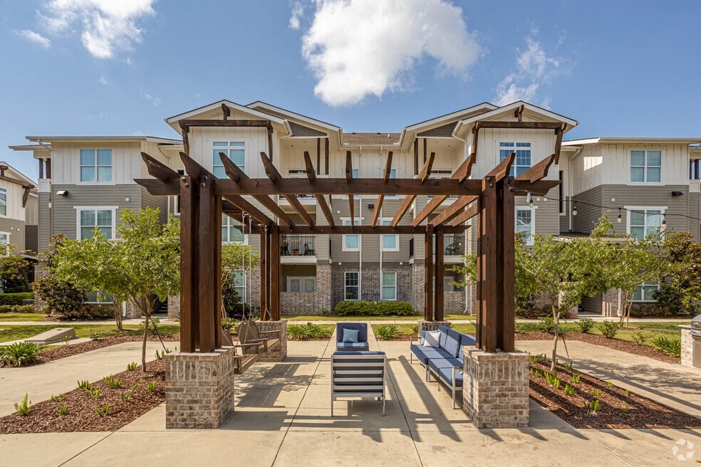 a pergola and lounge area at the bradley braddock road station apartments