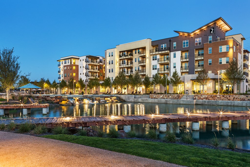 a view of the marina at night at the grove resort and spa