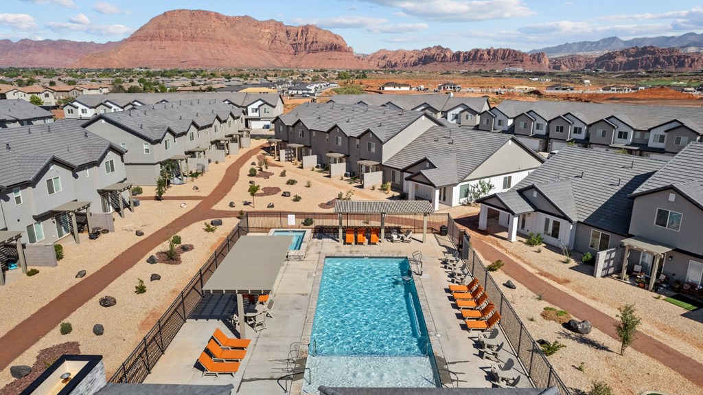 an aerial view of an apartment complex with a swimming pool