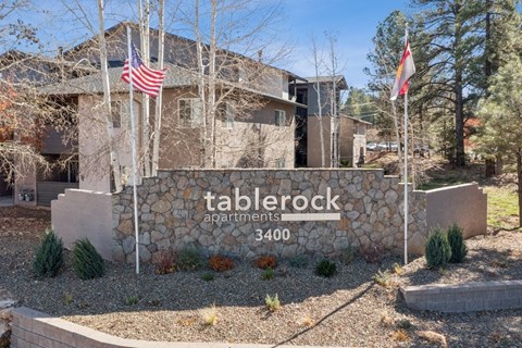 The image shows a sign for Tablerock Apartments with the number 3400 on it.