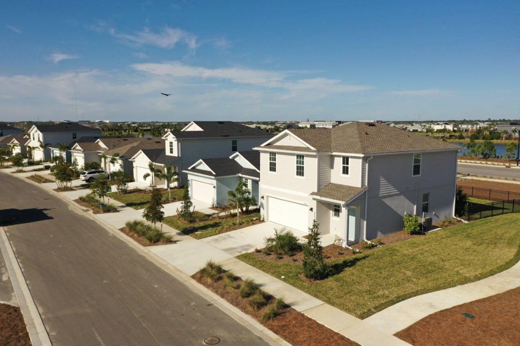 an aerial view of a row of houses on a street