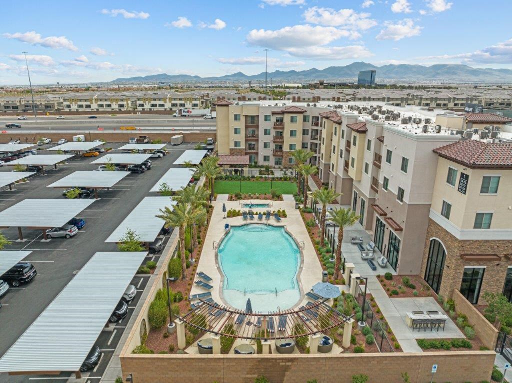 an aerial view of a pool in the middle of a city