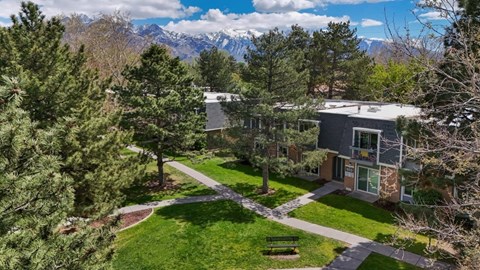 A building with a green lawn in front of it.