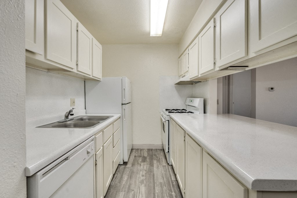 the preserve at ballantyne commons apartment kitchen with white cabinets