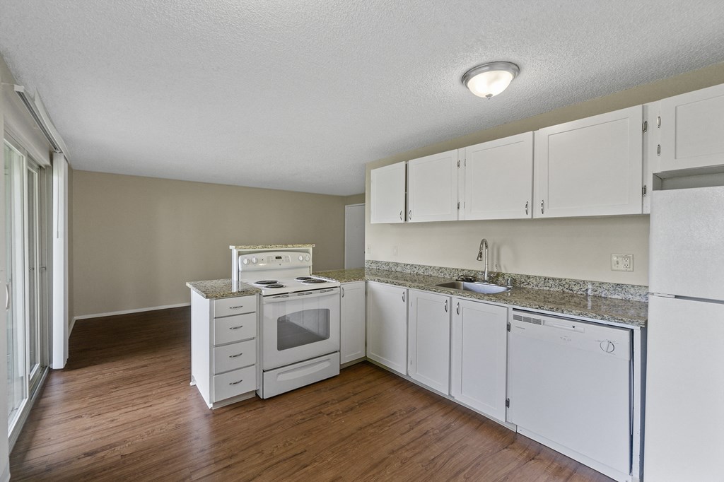the preserve at ballantyne commons apartment kitchen with white cabinets and appliances