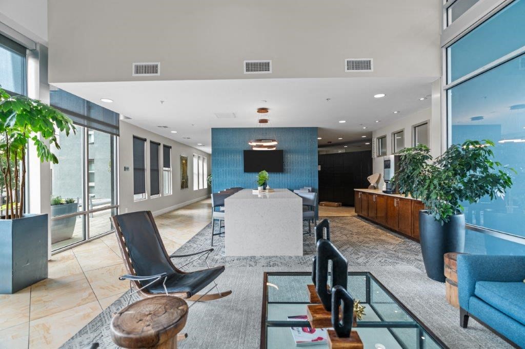 a large room with a table and chairs in the middle of it