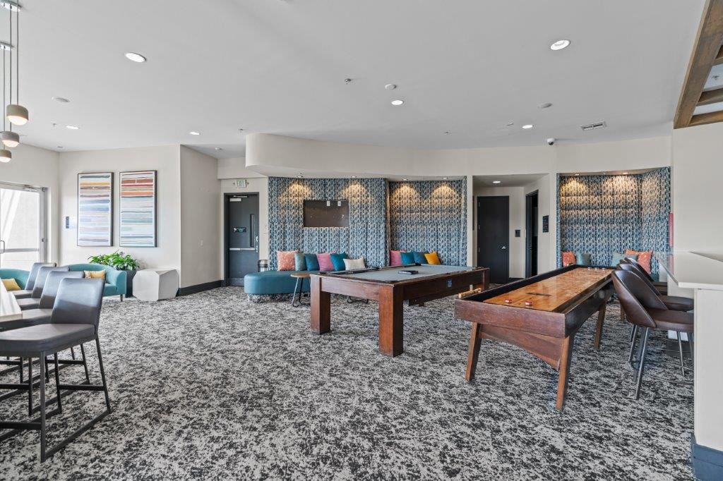 a room filled with furniture and a pool table
