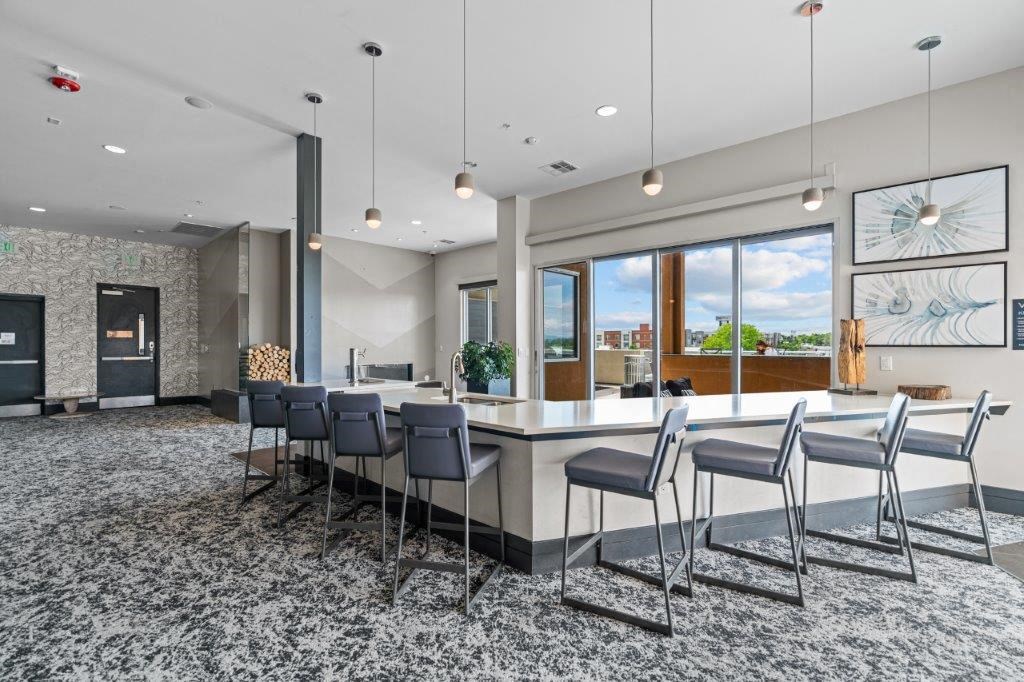 a room filled with furniture and a large window