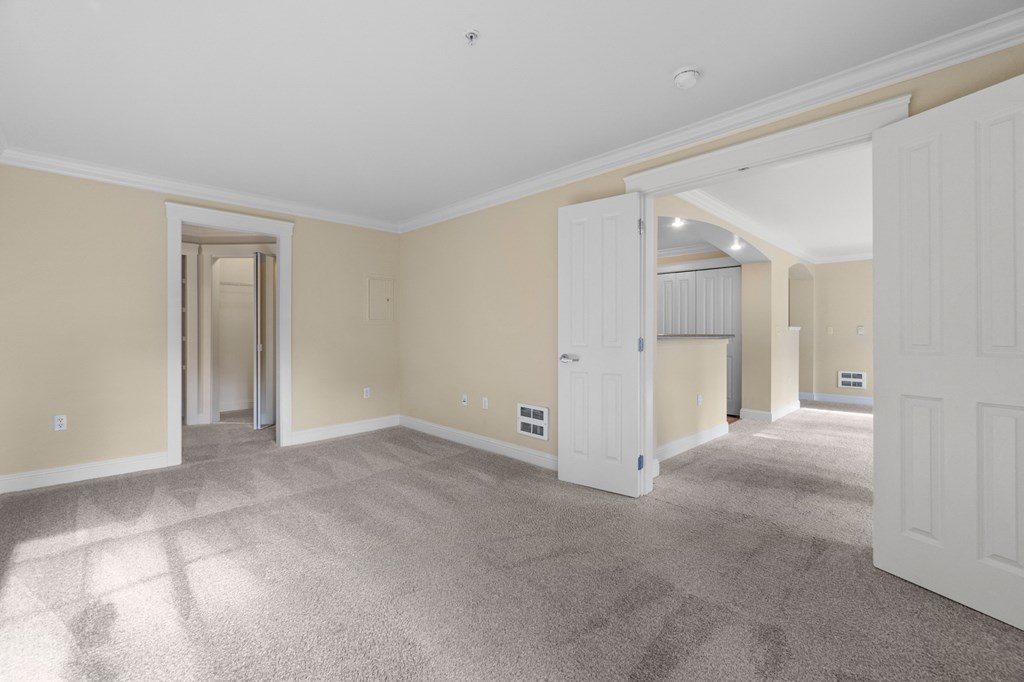 a living room with a carpeted floor