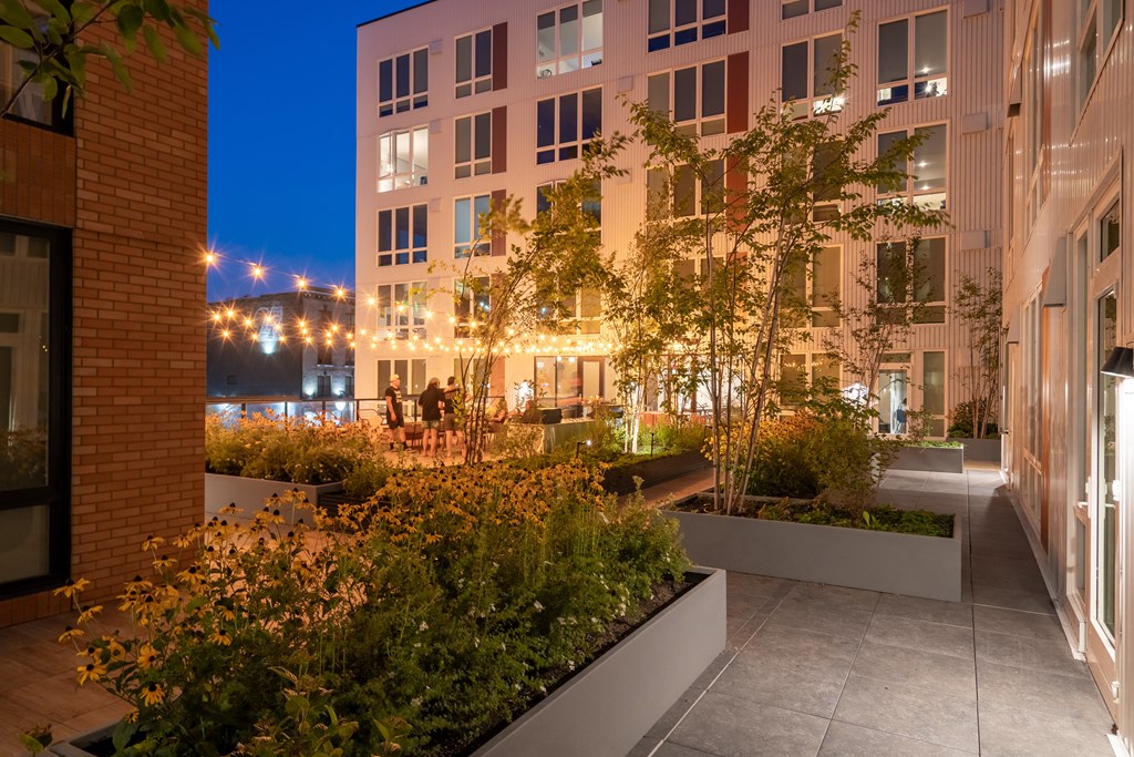 The Warren Apartments patio at night