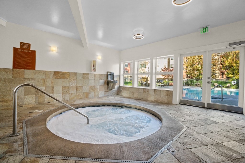 a jacuzzi with a view of the pool