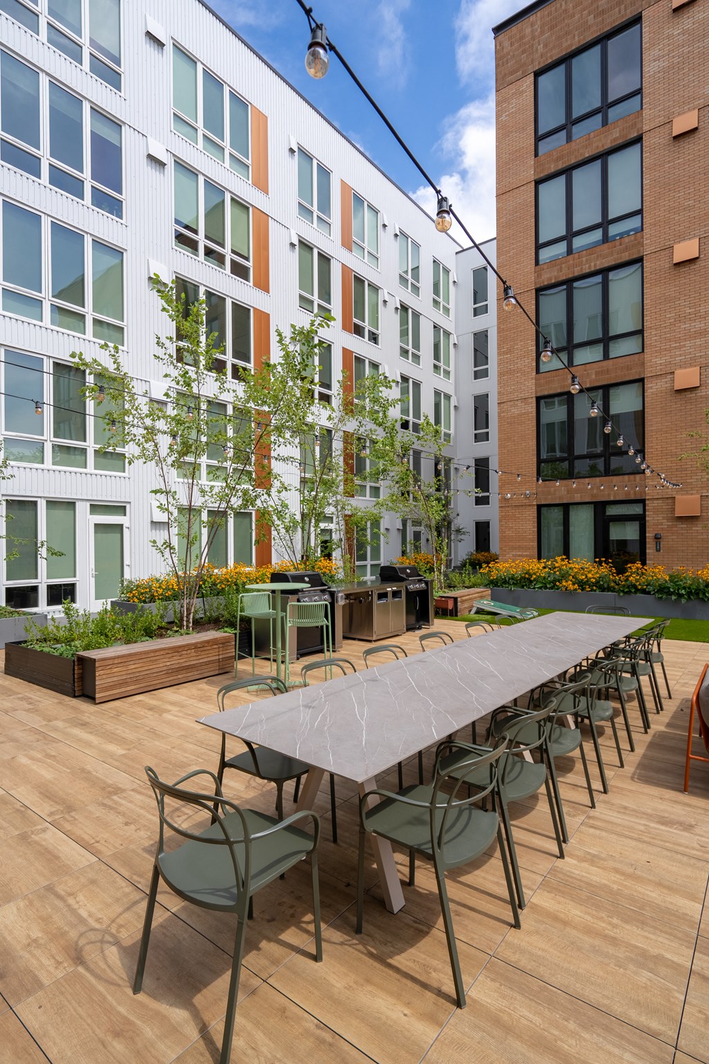 The Warren Apartments communal patio with dining area