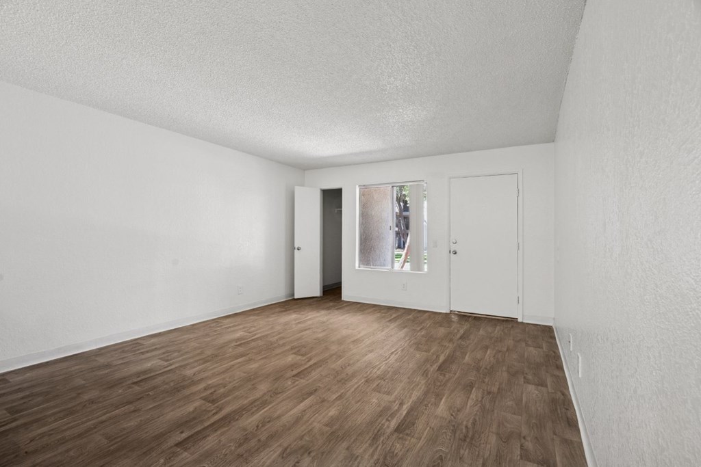 Casa Bella  living area with hardwood floors and window