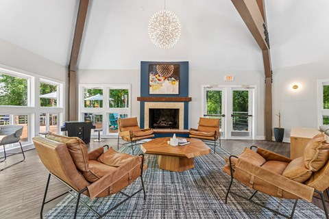 A living room with a fireplace and a chandelier.