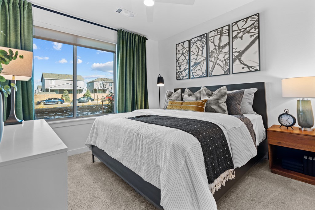 Aura Crossroads Apartments Bedroom with large bed and window