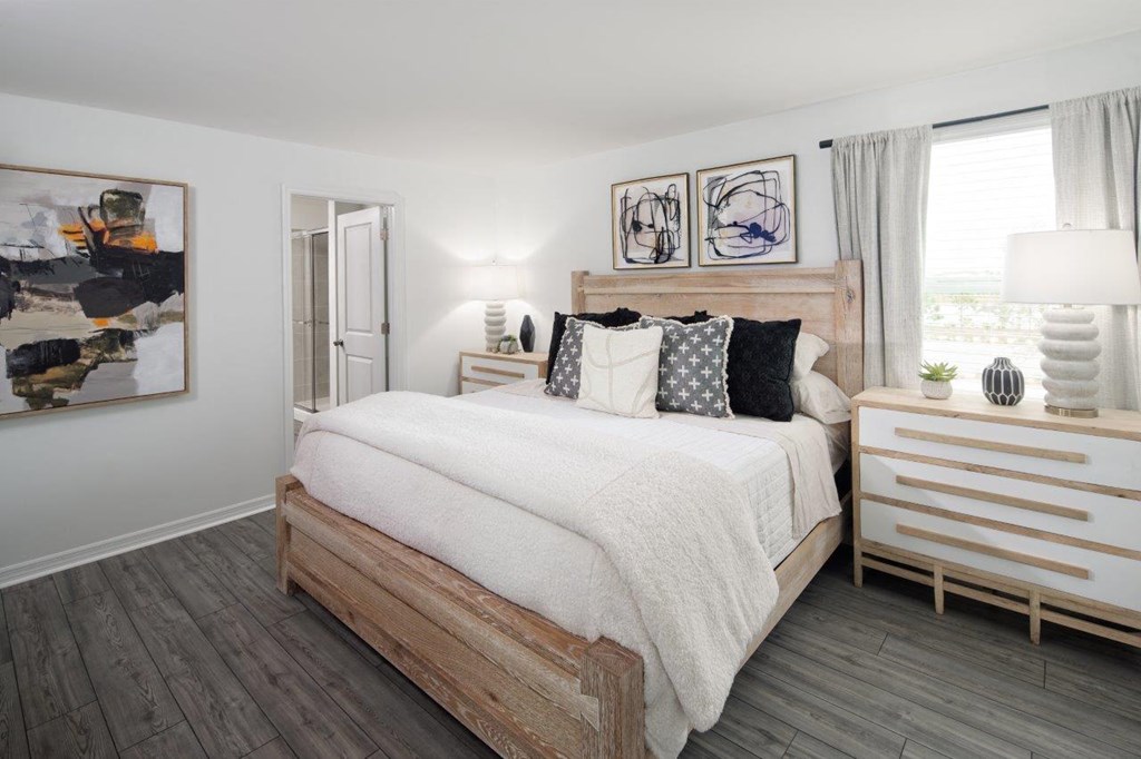 bedroom with queen bed and dark pillows