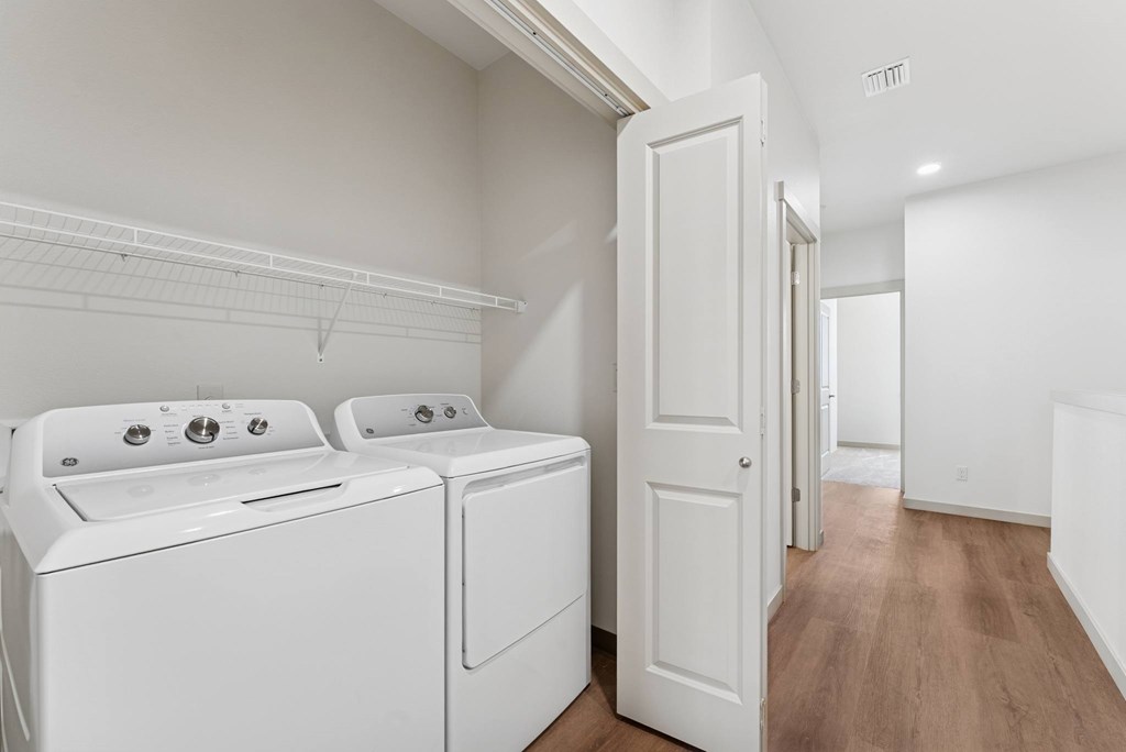 A laundry room with a washer and dryer.