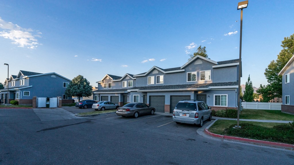 Avion Townhomes Exterior Townhomes with Garages and Cars Parked in Front
