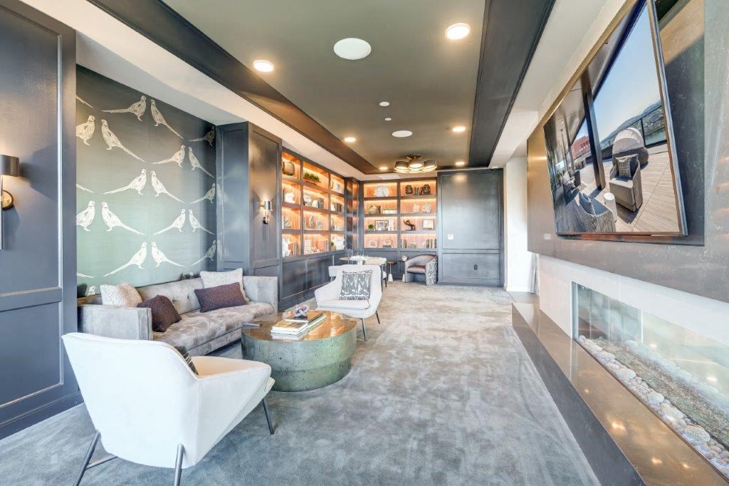 a living room filled with furniture and a fireplace
