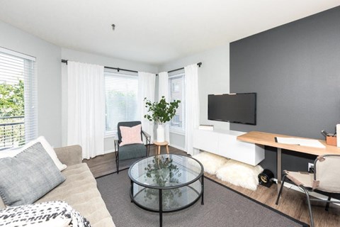 a living room with a couch and a table