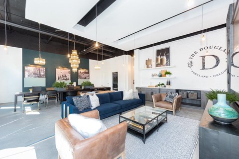 a living room with a blue couch and a table