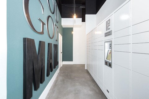 a hallway with a blue wall with a coo coo mine logo on it