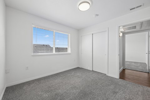 A room with a window and a door.