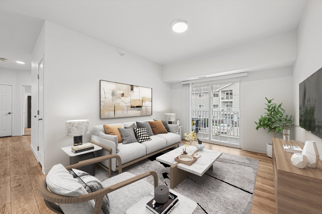 A modern living room with a grey sofa, a coffee table, and a large painting on the wall.