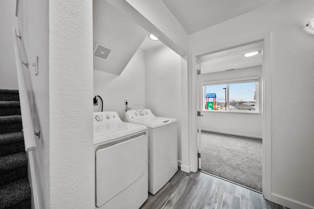 a laundry room with a washer and dryer