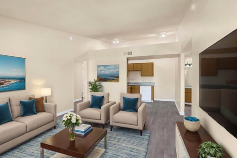 A living room with a couch, chairs, and a coffee table.