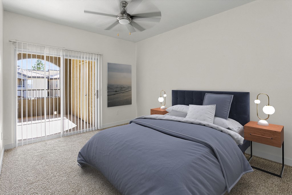 a bedroom with a bed and a ceiling fan