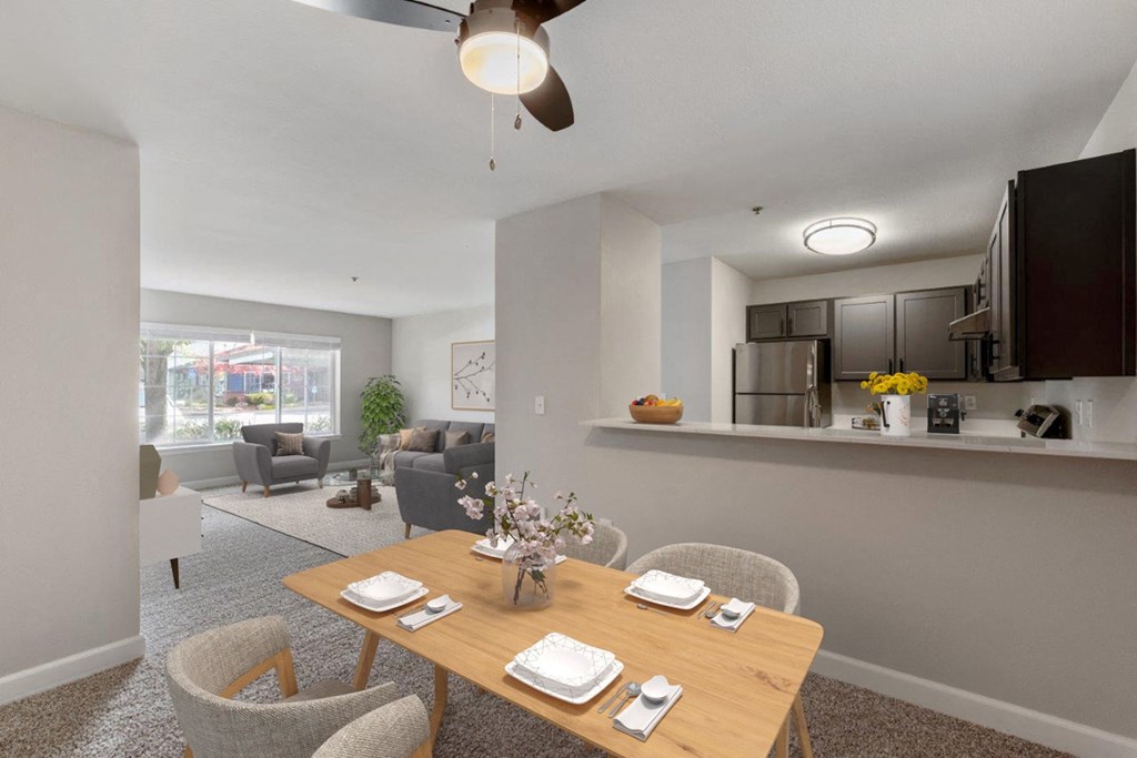 an open living room and dining room with a table and chairs