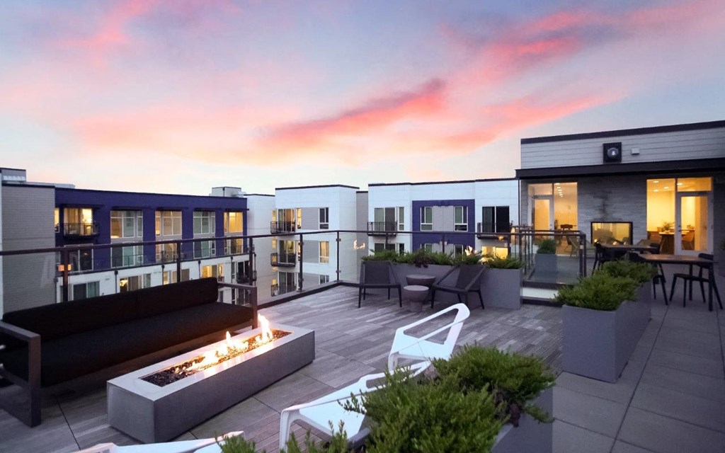 Paceline Apartments Clubhouse Rooftop Firepit at Sunset