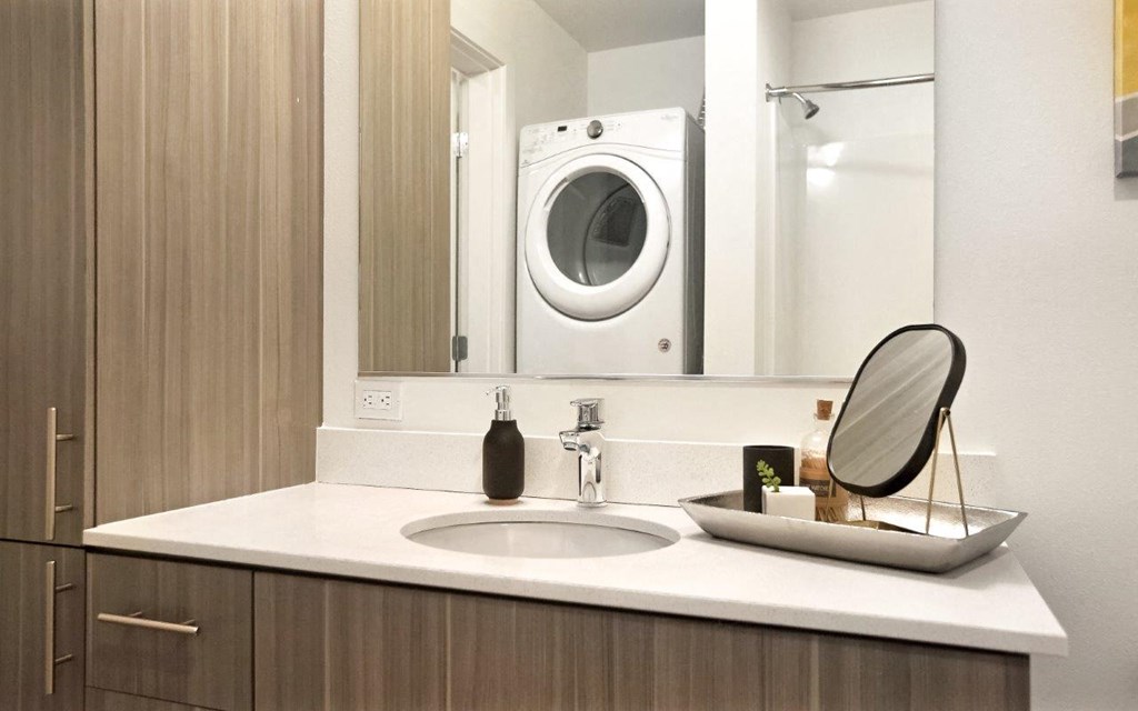 Paceline Apartments Bathroom with Stacked Washer and Dryer