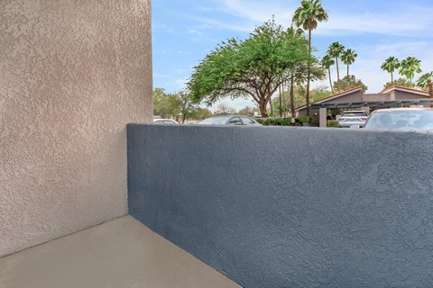 A wall with a blue painted section in the middle.